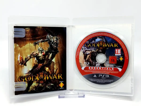 Interior del juego God of War III (ESP) (Essentials) para PlayStation 3 con disco y manual
