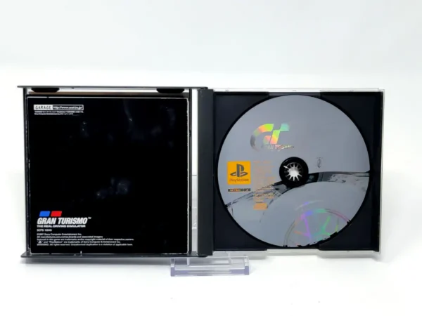 Interior del juego Gran Turismo (JAP) para PlayStation 1 con disco y manual