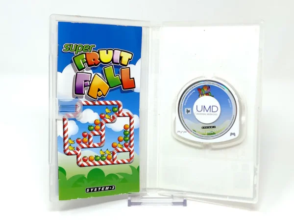 Interior del juego Super Fruit Fall (UK) para PSP con disco y manual