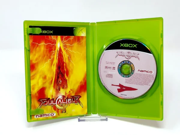 Interior del juego Soulcalibur II (ESP) para XBOX con disco y manual