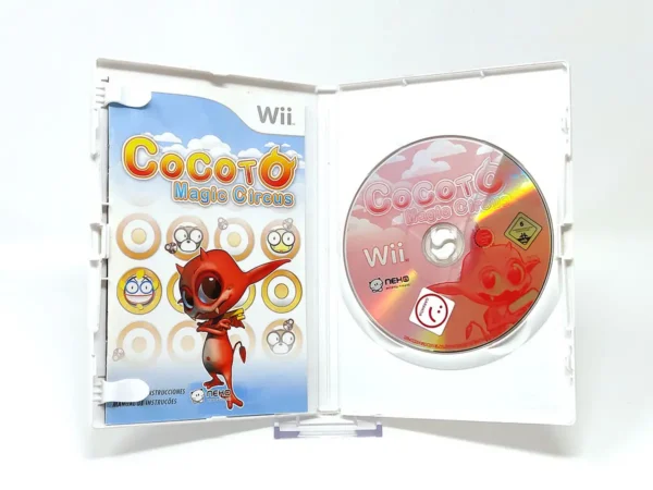 Interior del juego Cocoto Magic Circus (ESP) para Nintendo Wii con disco y manual