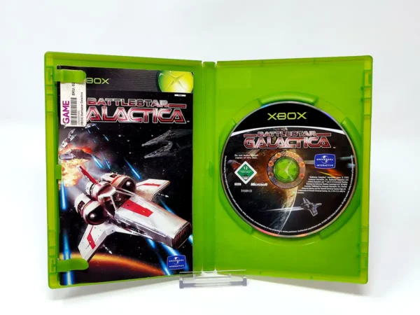 Interior del juego Battlestar Galactica (ESP) para XBOX con disco y manual