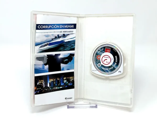 Interior del juego Corrupción en Miami: El Videojuego (ESP) para PSP con disco y manual