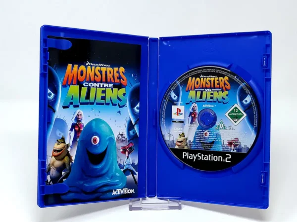 Interior del juego Monstres Contre Aliens (FRA) para PlayStation 2 con disco y manual