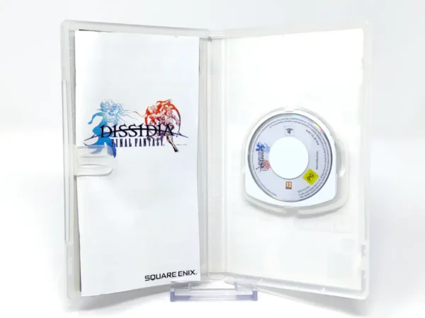 Interior del juego Dissidia Final Fantasy (ESP) (Essentials) para PSP con disco y manual
