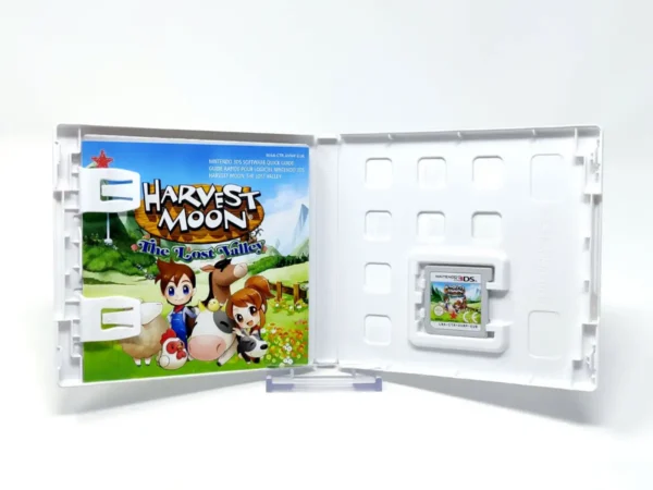 Interior del juego Harvest Moon: El Valle Perdido (ESP) para Nintendo 3DS con disco y manual
