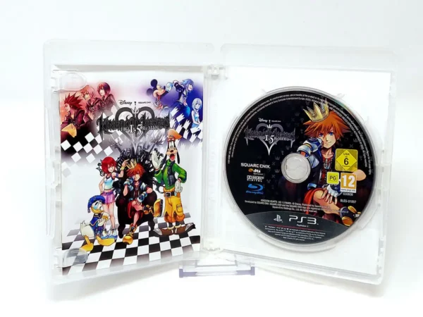 Interior del juego Kingdom Hearts: HD 1.5 ReMIX (ESP) para PlayStation 3 con disco y manual