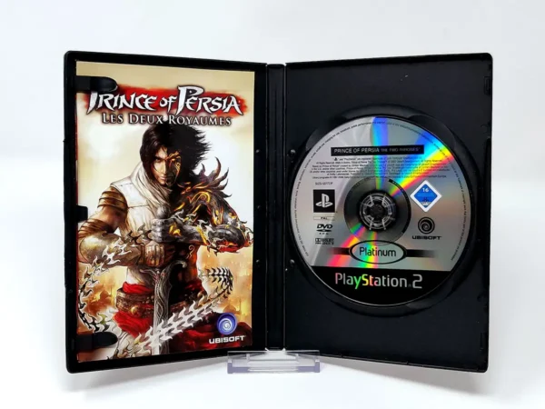 Interior del juego Prince of Persia: Les Deux Royaumes (FRA) (Platinum) para PlayStation 2 con disco y manual