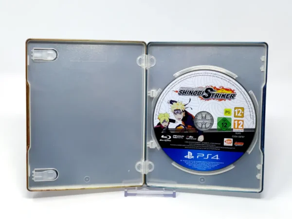 Interior del juego Naruto to Boruto: Shinobi Striker (ESP) (Steelbook) para PlayStation 4 con disco y manual