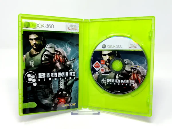 Interior del juego Bionic Commando (ESP) para XBOX 360 con disco y manual