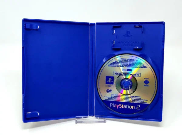Interior del juego Gran Turismo 4 (ESP) (Promo) para PlayStation 2 con disco y manual