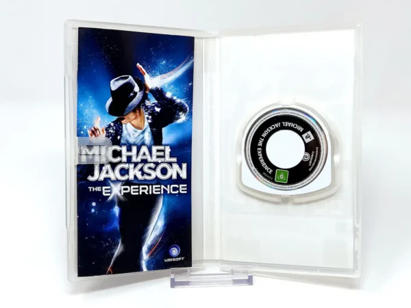 Interior del juego Michael Jackson: The Experience (ESP) para PSP con disco y manual