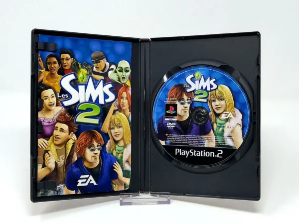 Interior del juego Les Sims 2 (FRA) para PlayStation 2 con disco y manual