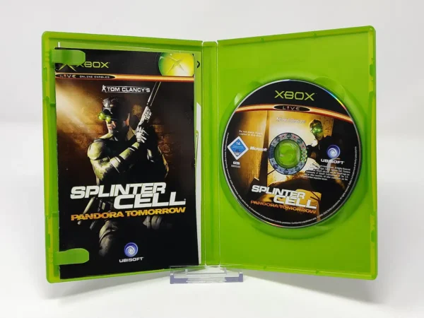 Interior del juego Tom Clancy's Splinter Cell: Pandora Tomorrow (UK) para XBOX con disco y manual