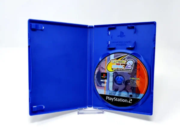 Interior del juego Capcom vs. SNK 2: Mark of the Millennium 2001 (UK) (Rebajado) para PlayStation 2 con disco y manual