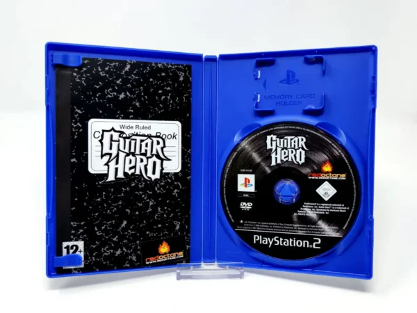 Interior del juego Guitar Hero (ESP) para PlayStation 2 con disco y manual