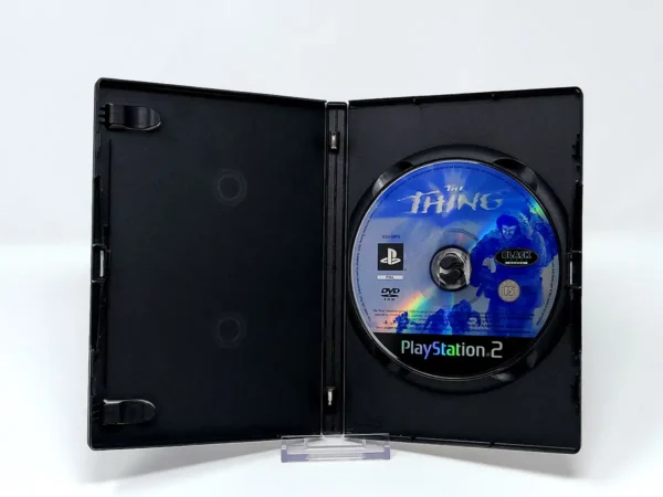 Interior del juego The Thing (FRA) (Rebajado) para PlayStation 2 con disco y manual