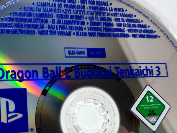 Interior del juego Dragon Ball Z: Budokai Tenkaichi 3 (EUR) (Promo) para PlayStation 2 con disco y manual