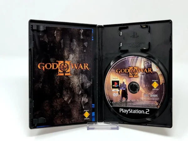 Interior del juego God of War II (ESP) (Platinum) para PlayStation 2 con disco y manual