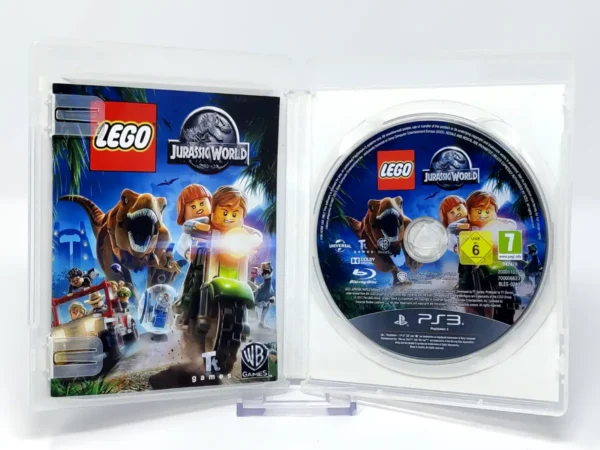 Interior del juego LEGO Jurassic World (ALE) para PlayStation 3 con disco y manual