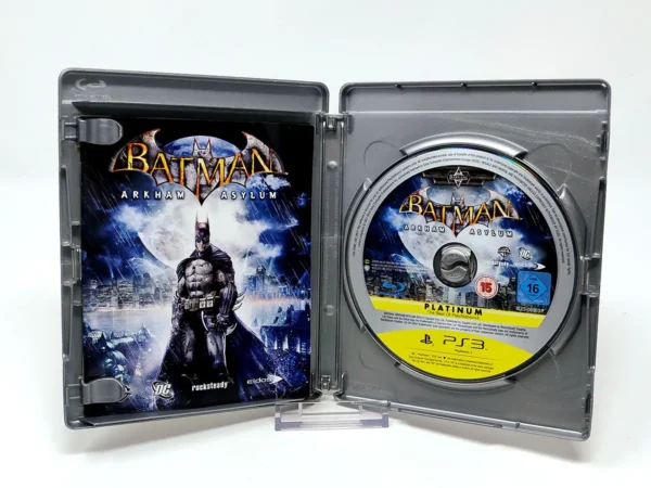 Interior del juego Batman: Arkham Asylum (ESP) (Platinum) para PlayStation 3 con disco y manual