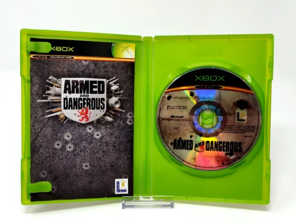 Interior del juego Armed and Dangerous (FRA) para XBOX con disco y manual