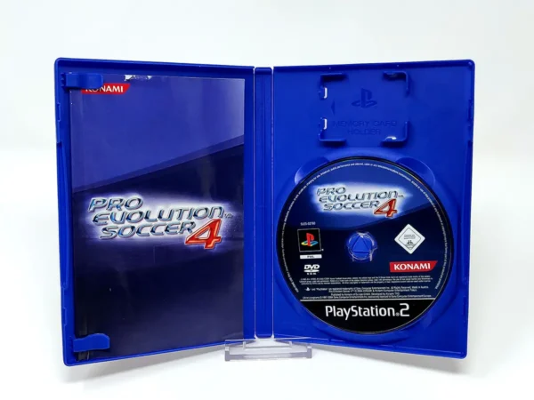 Interior del juego Pro Evolution Soccer 4 (ESP) para PlayStation 2 con disco y manual