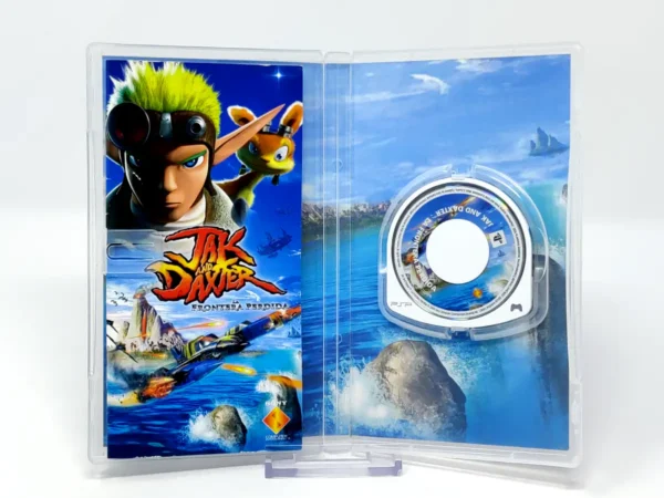 Interior del juego Jak and Daxter: La Frontera Perdida (ESP) para PSP con disco y manual