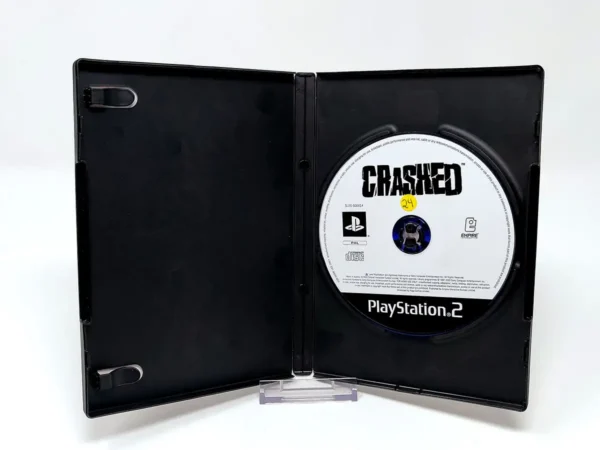 Interior del juego Crashed (FRA) (Rebajado) para PlayStation 2 con disco y manual