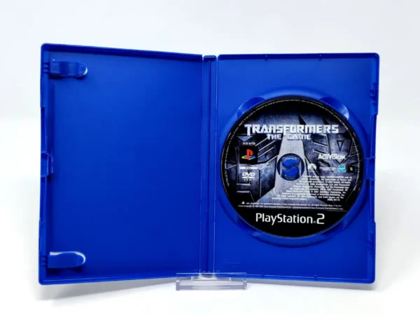 Interior del juego Transformers: The Game (ESP) (Rebajado) para PlayStation 2 con disco y manual