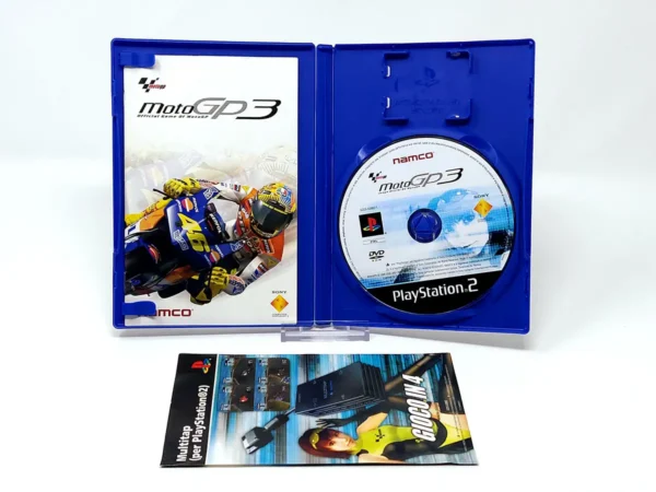 Interior del juego MotoGP 3 (ITA) para PlayStation 2 con disco y manual