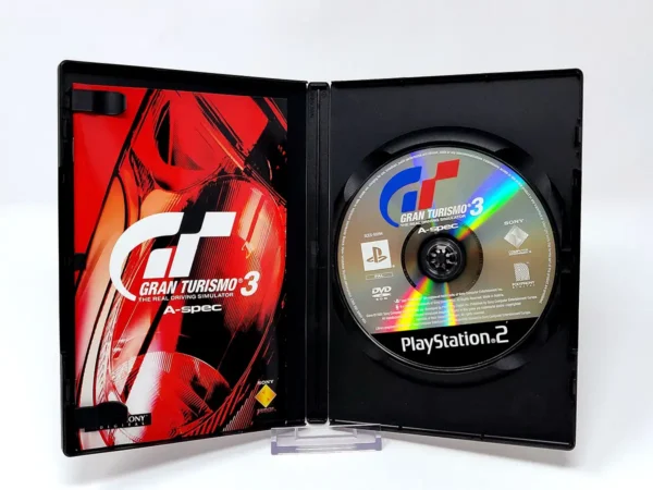 Interior del juego Gran Turismo 3: A-Spec (ESP) para PlayStation 2 con disco y manual