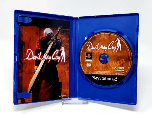 Interior del juego Devil May Cry (ESP) para PlayStation 2 con disco y manual
