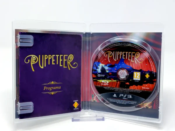 Interior del juego Puppeteer (ESP) para PlayStation 3 con disco y manual