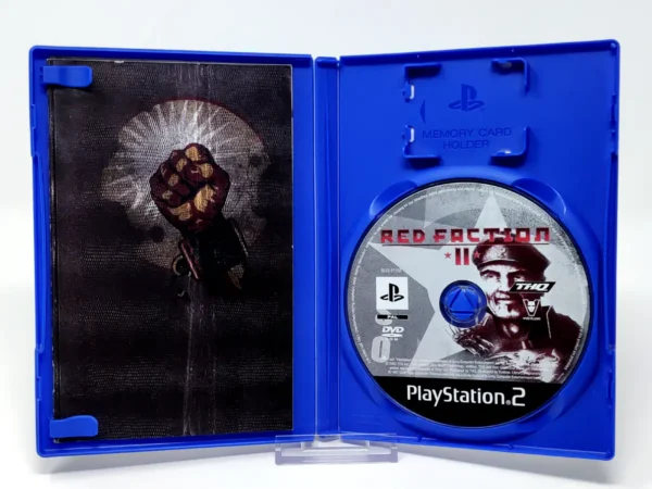 Interior del juego Red Faction II (UK) para PlayStation 2 con disco y manual