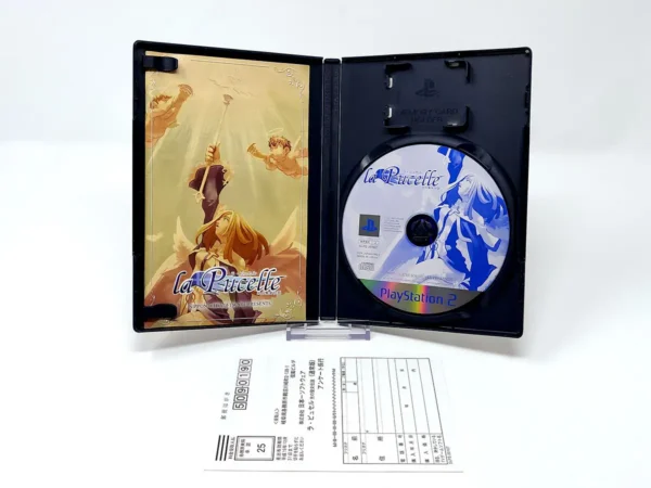 Interior del juego La Pucelle: Hikari no Seijo Densetsu (JAP) para PlayStation 2 con disco y manual
