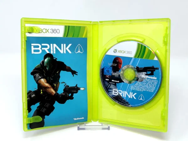 Interior del juego Brink (ESP) para XBOX 360 con disco y manual