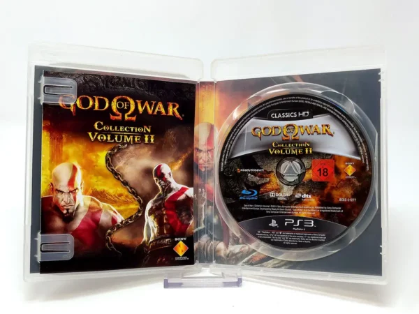 Interior del juego God of War Collection: Volume II (ESP) para PlayStation 3 con disco y manual