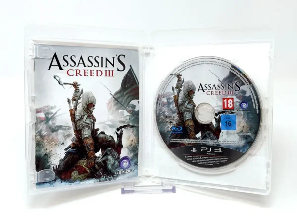 Interior del juego Assassin's Creed III (FRA) para PlayStation 3 con disco y manual