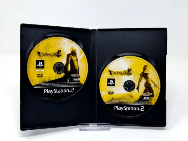 Interior del juego Devil May Cry 2 (ESP) (Rebajado) para PlayStation 2 con disco y manual