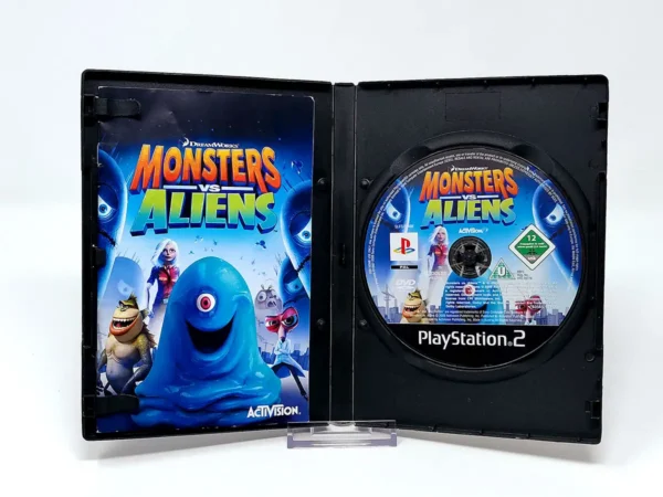 Interior del juego Monsters vs. Aliens (UK) para PlayStation 2 con disco y manual