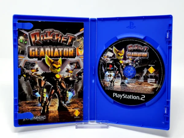 Interior del juego Ratchet: Gladiator (ESP) para PlayStation 2 con disco y manual