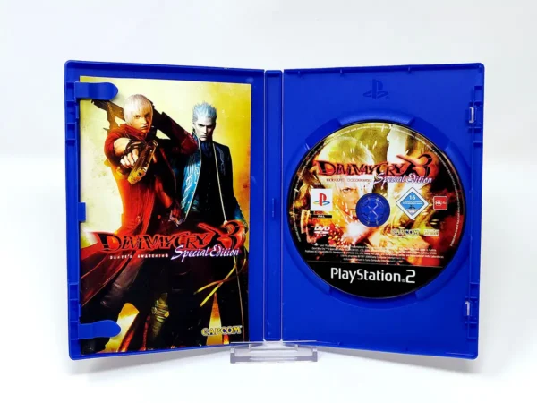 Interior del juego Devil May Cry 3: Dante's Awakening (Special Edition) (ESP) para PlayStation 2 con disco y manual