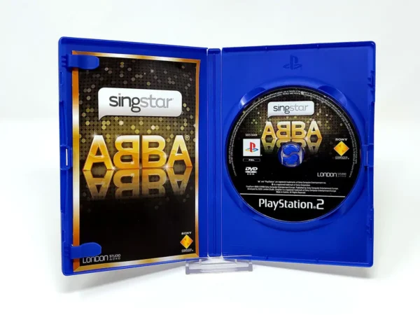 Interior del juego SingStar ABBA (ALE) para PlayStation 2 con disco y manual