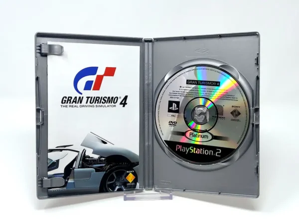 Interior del juego Gran Turismo 4 (FRA) (Platinum) para PlayStation 2 con disco y manual
