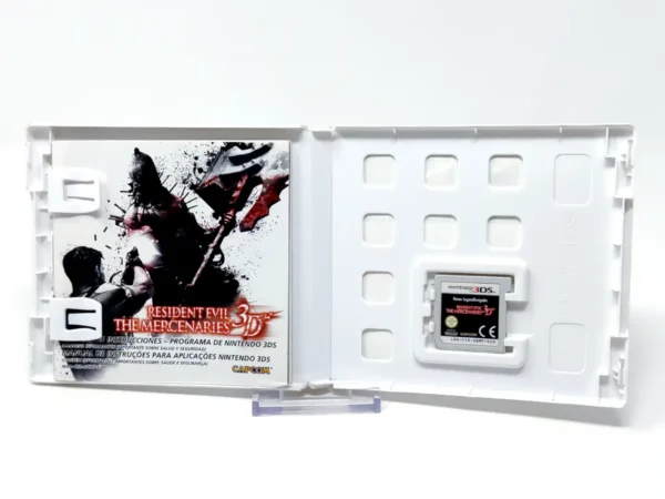 Interior del juego Resident Evil: The Mercenaries 3D (ESP) para Nintendo 3DS con disco y manual