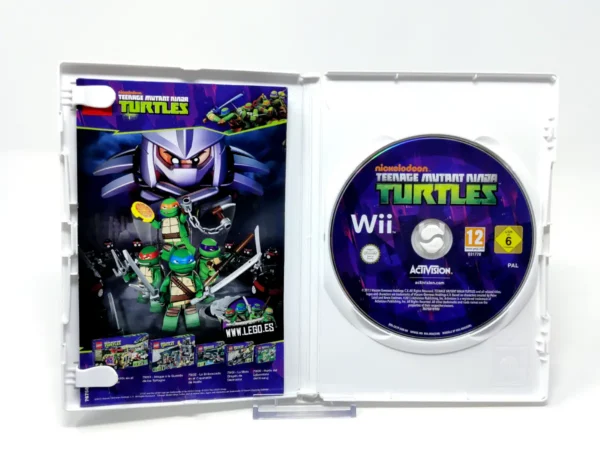 Interior del juego Teenage Mutant Ninja Turtles Nickelodeon (ESP) para Nintendo Wii con disco y manual