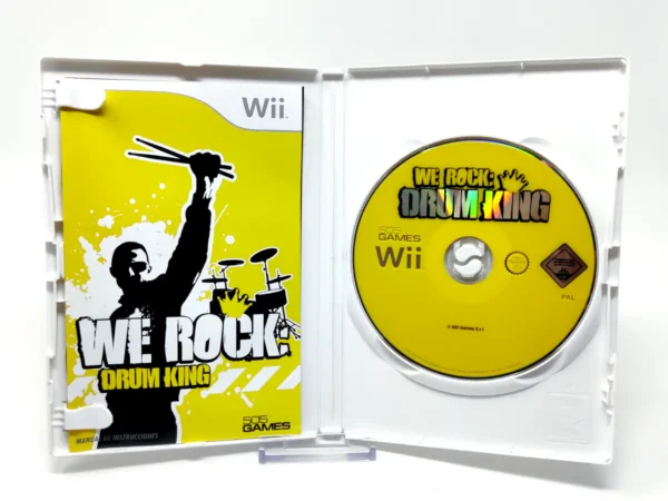 Interior del juego We Rock: Drum King (ESP) para Nintendo Wii con disco y manual