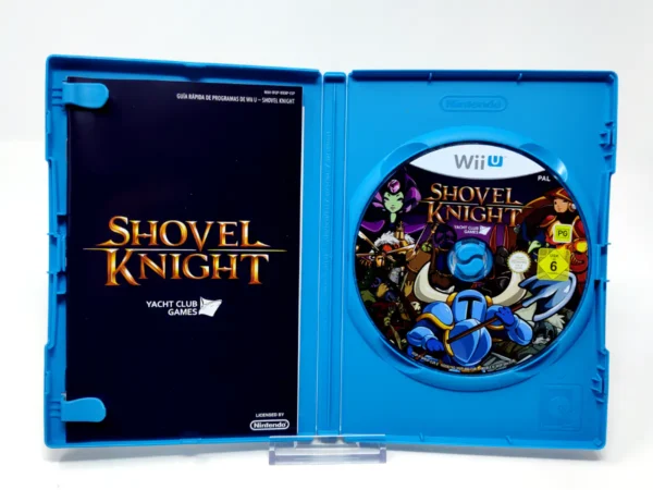 Interior del juego Shovel Knight (ESP) para Nintendo Wii U con disco y manual