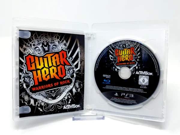 Interior del juego Guitar Hero: Warriors of Rock (EUR) para PlayStation 3 con disco y manual